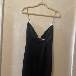 black long dress with rhinestone strap and slit in the back.